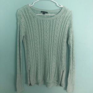 mint green cable knit sweater with zippers.